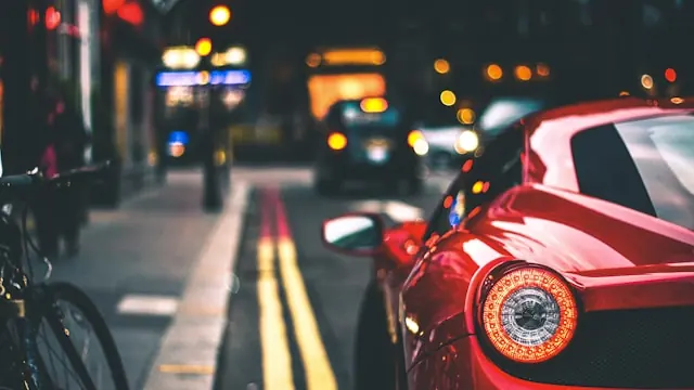 Red car representing a private number plate company